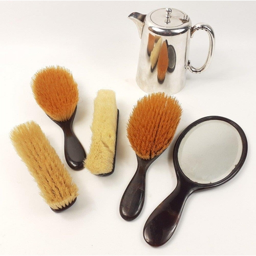 564 - A quantity of turtle shell brushes with a mirror.  Pretty attractive pieces.  Includes a stainless s... 