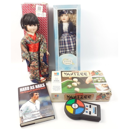 588 - A mixed box to include 2 dolls, one from the Windsor Collection, Yantzee game, pocket Simon,#591