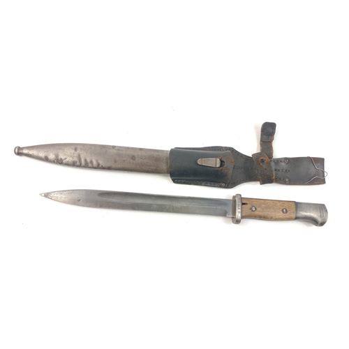 79 - A military bayonet with metal scabbard and frog in good order.  Blade stamped RBD29 and marked 1636 ... 