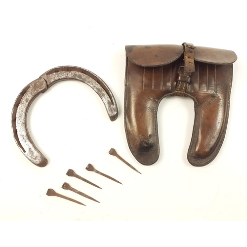 91 - A lovely WWI cavalry officer's repair kit in leather case comprising a hinged folding horse shoe and... 