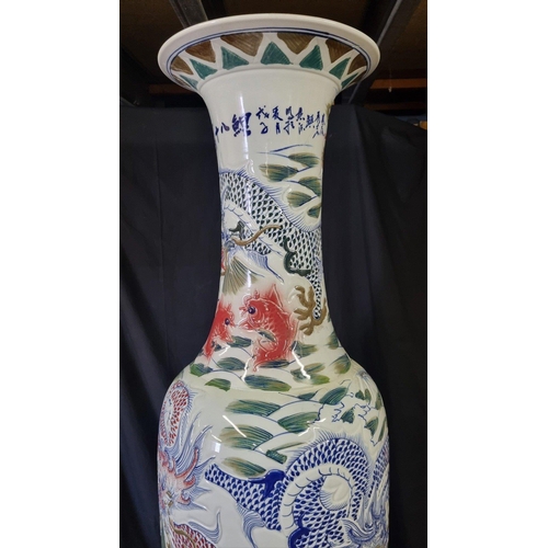 297 - An absolutely stunning original handmade porcelain vase which stands just over 7ft. The vase has gre... 