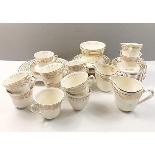 163 - A PORTLAND POTTERY tea set in cream and gilt to include two large (23cm) sandwich plates, 11x17cm si... 