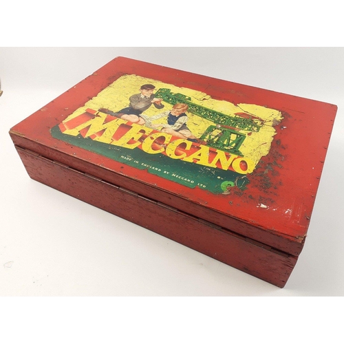 202 - A vintage wooden MECCANO chest containing a useful selection of red, green and brass components incl... 