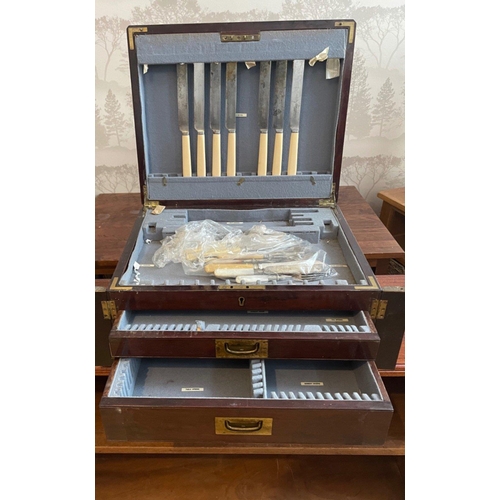 91 - A VICTORIAN substantial mahogany two drawer cutlery canteen with brass outer fittings with fitted in... 