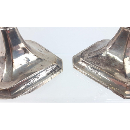 100 - CLASSY! A pair of filled silver candlesticks, Chester 1914, standing 23cm high, base damaged#100