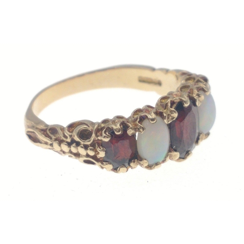 11 - A 375 fully hallmarked opal and garnet ring, largest centre stone measures 6mm approx, size O, gross... 