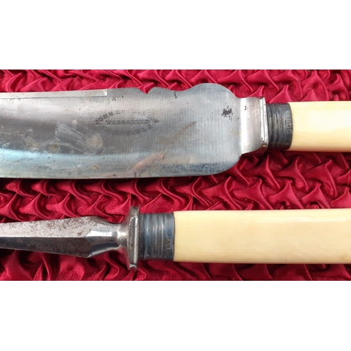 126 - A carving set by John Anderson with silver collars hallmarked for Sheffield.  Steel missing in prese... 