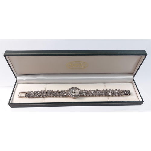 143 - A ladies quartz cocktail watch with Japanese movement in marcasite bracelet with silver hallmarked c... 