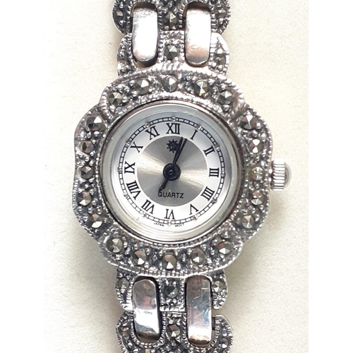 143 - A ladies quartz cocktail watch with Japanese movement in marcasite bracelet with silver hallmarked c... 