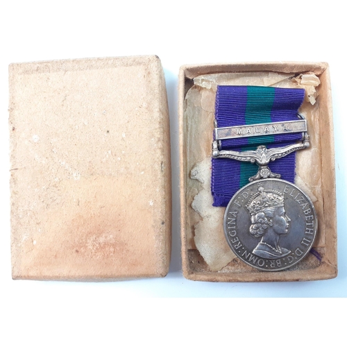 152 - A boxed QEII general service medal with Malaya bar, named on rim to 23022190 Pte. A Brown KOSB#154... 