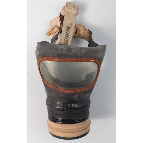 154 - A medium size gas mask in original box with string#156