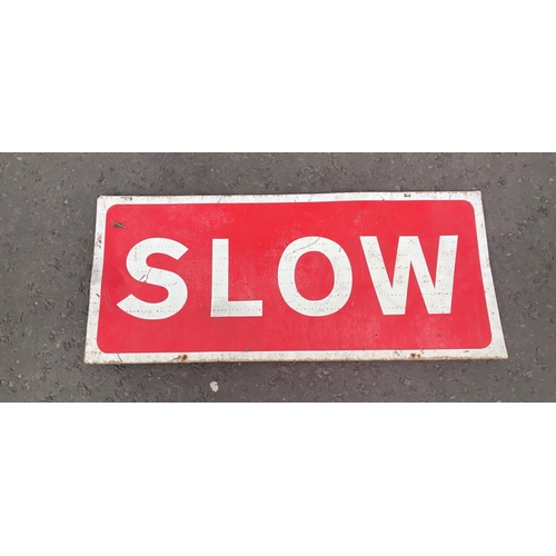 186 - A rectangular SLOW metal road sign - dimensions 2ft long x 1ft height approx#188