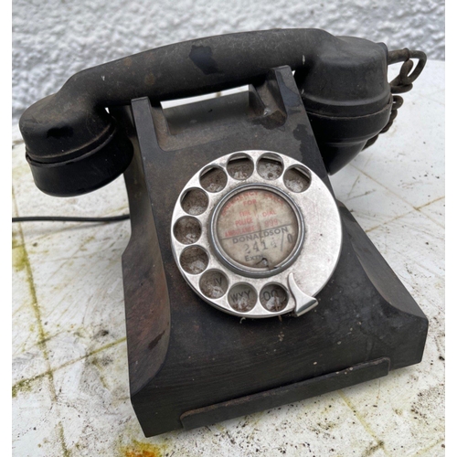 208 - A VINTAGE early black bakelite telephone#210