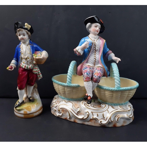 214 - A MEISSEN porcelain figural double salt, modelled as a young boy wearing 18th century costume, and s... 