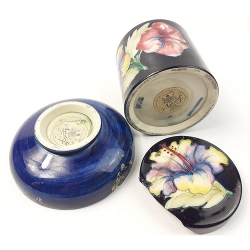 223 - An original early MOORCROFT 9cm jar with hibiscus pattern, base is in excellent condition and the li... 