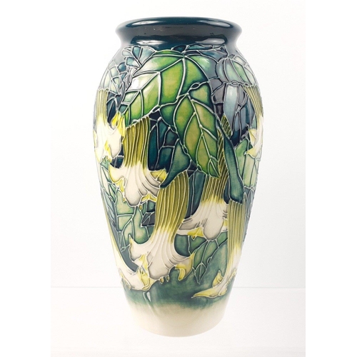 230 - A stunning boxed MOORCROFT vase 19cm high with a design of trumpet lilies, fully signed and dated 19... 