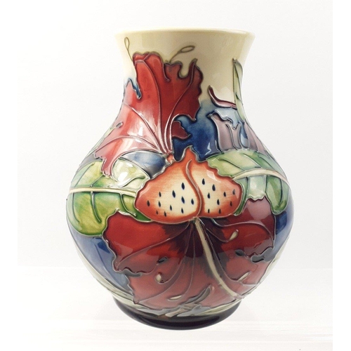 233 - A boxed MOORCROFT hibiscus vase 15cm high. In very good condition#235