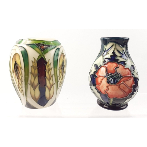 234 - Two lovely MOORCROFT small vases in boxes each approx 9cm.  In very good condition#236