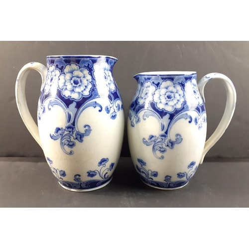 236 - A pair of ROYAL DOULTON Henry jugs, the larger 19cm approx.  Both in good order.#238