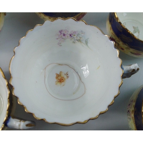 247 - A pretty vintage tea service in cobalt blue with gilt edgings to include 7 cups, 10 saucers, 11 side... 