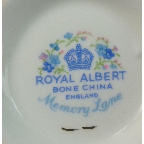 249 - A ROYAL ALBERT Memory Lane tea service to include 6 each of cups, saucers, side plates, 1 milk jug, ... 