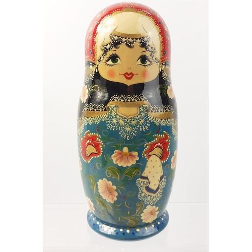 259 - A set of five Russian Matryoshka nested dolls - the tallest being 20cm approx#261