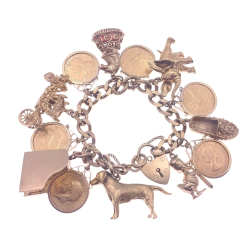 26 - A truly superlative gold charm bracelet set with no fewer than 6 full sovereigns mounted in 9ct gold... 