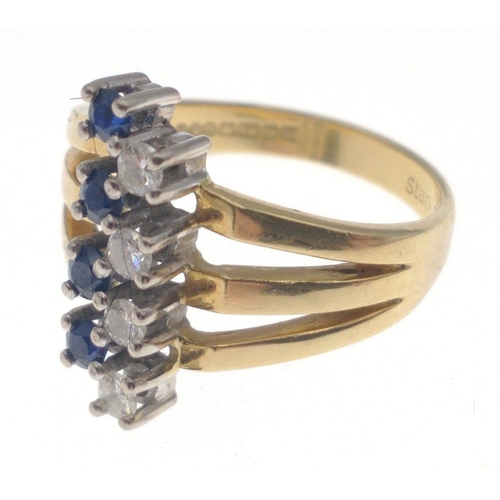 3 - A fully UK hallmarked 18ct gold ring by S&D, stamped Starlight (Singapore), with 4 offset sapphi... 