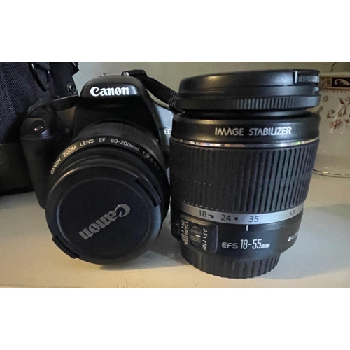 389 - A CANON digital camera 450D which comes with two compatible lenses and a CANON camera bag in black, ... 