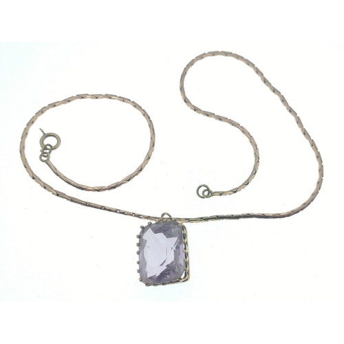 39 - AMAZING AMETHYST! A 9ct stamped pendant with amethyst coloured centre stone presented on a 9ct chain... 