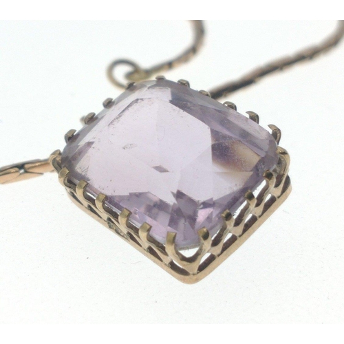 39 - AMAZING AMETHYST! A 9ct stamped pendant with amethyst coloured centre stone presented on a 9ct chain... 