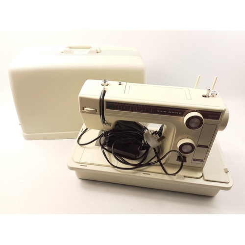 409 - An electric NEW HOME 361 sewing machine in case. In excellent clean condition#412