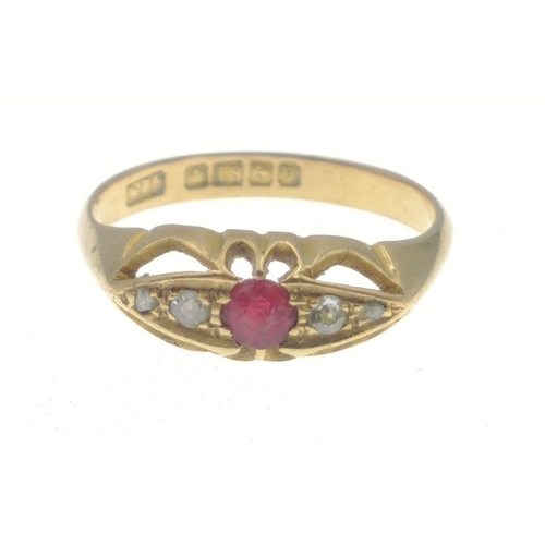 5 - An 18ct gold ring with 4 small diamonds (tested), and a central red stone, fully hallmarked, gross w... 