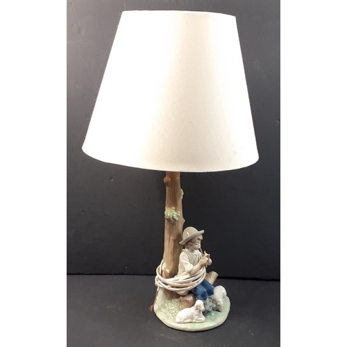 503 - A NAO table lamp with a shepherd boy, stands 52cm inc. shade. No damage to extremities.#509