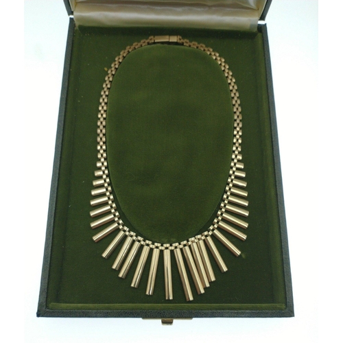 55 - An Egyptian inspired frond necklace, stamped 375 to clasp, weight 27.0g approx - still within its or... 