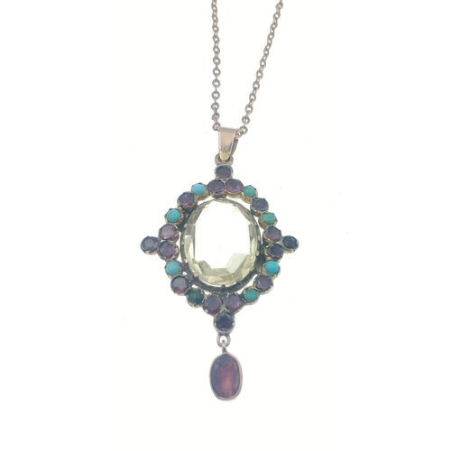 56 - A very pretty drop pendant with small turquoise and other stones and a large clear glass centre ston... 