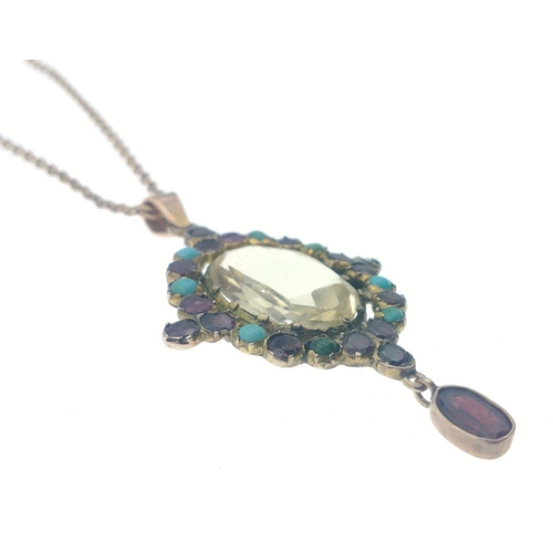 56 - A very pretty drop pendant with small turquoise and other stones and a large clear glass centre ston... 