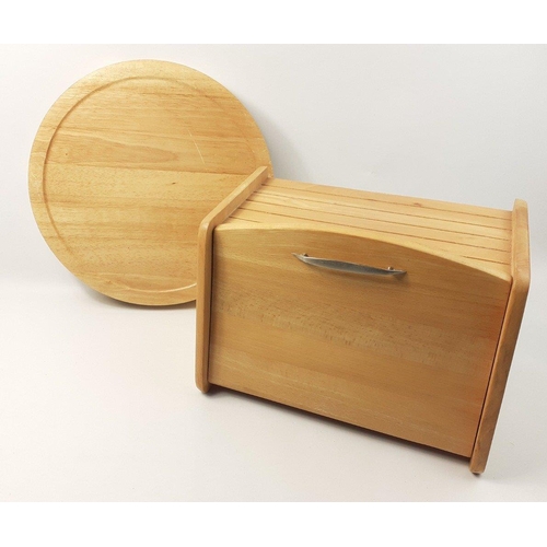 561 - A wooden bread bin and large round bread board (35cm diameter)#567