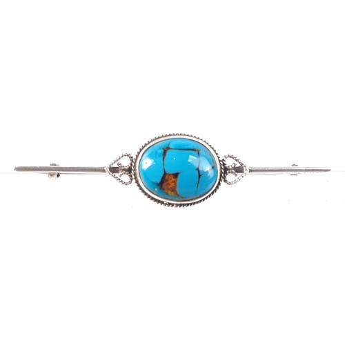 78 - Two pretty STERLING SILVER pin brooches both with turquoise centre stones. The smaller brooch has tw... 