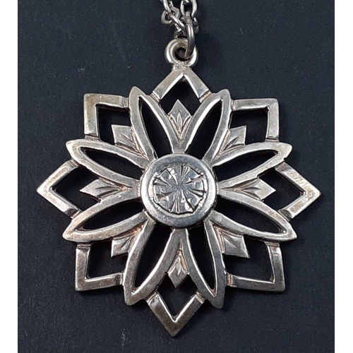 86 - A star-shaped pendant with Edinburgh hallmarks made by JF, with chain stamped sterling, weight 15g a... 