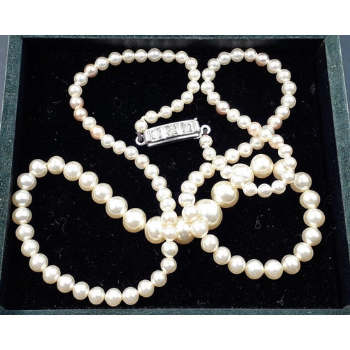 90 - A string of natural graduated pearls with a 835 stamped clasp, 40cm long approx#90