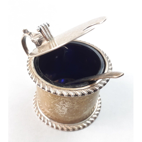 125 - A BIRMINGHAM hallmarked silver mustard pot with blue glass liner and comes with a small white metal ... 