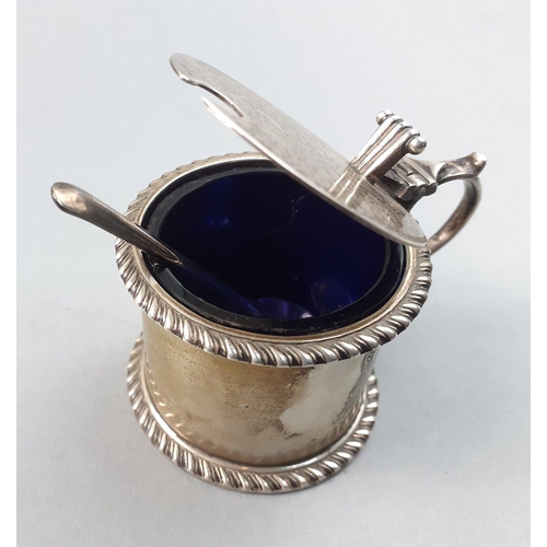 125 - A BIRMINGHAM hallmarked silver mustard pot with blue glass liner and comes with a small white metal ... 