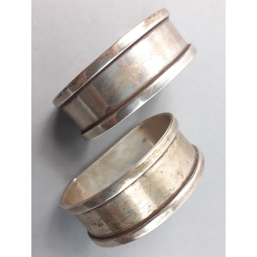 126 - A pair of hallmarked sterling silver napkin rings.  Birmingham 1858 by Henry Griffiths & Sons, w... 