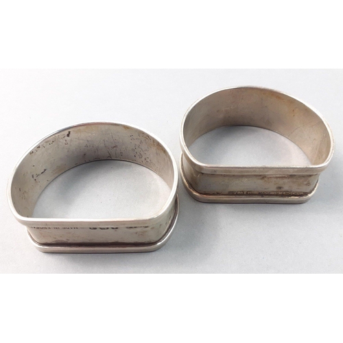 126 - A pair of hallmarked sterling silver napkin rings.  Birmingham 1858 by Henry Griffiths & Sons, w... 