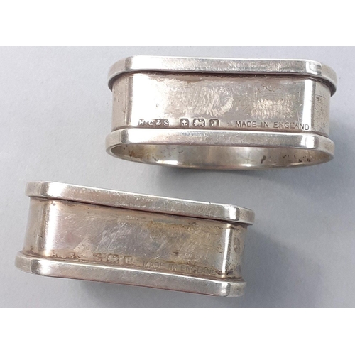 126 - A pair of hallmarked sterling silver napkin rings.  Birmingham 1858 by Henry Griffiths & Sons, w... 