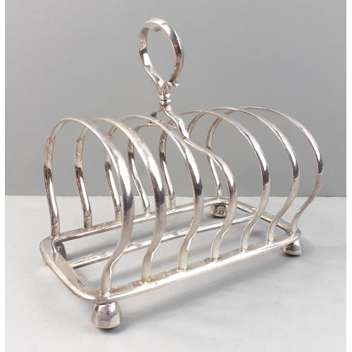 127 - A STERLING SILVER fully hallmarked toast rack marked for Sheffield 1933.  Maker Jay, Richard Attenbo... 