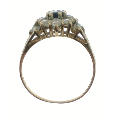 13 - A 9ct hallmarked gold ring size L, set with cubic zirconas and a central blue stone, gross weight 2.... 