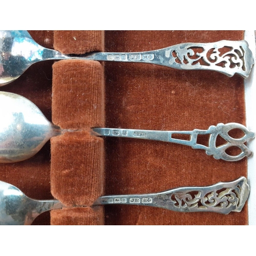 132 - A case containing six silver teaspoons.  All STERLING SILVER, various hallmarks.  Total weight 72g a... 