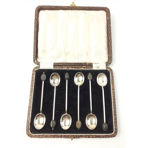 146 - A set of 6 boxed spoons with coffee bean finials hallmarked Birmingham 1923, each 10cm long, gross w... 